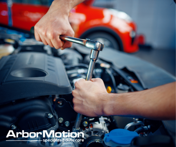 Working on engine components under the hood.